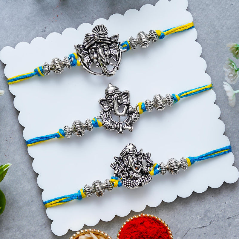 Lord Ganesha Rakhi Set of 3 – Antique Metal Finish – Free Chawal & Kumkum