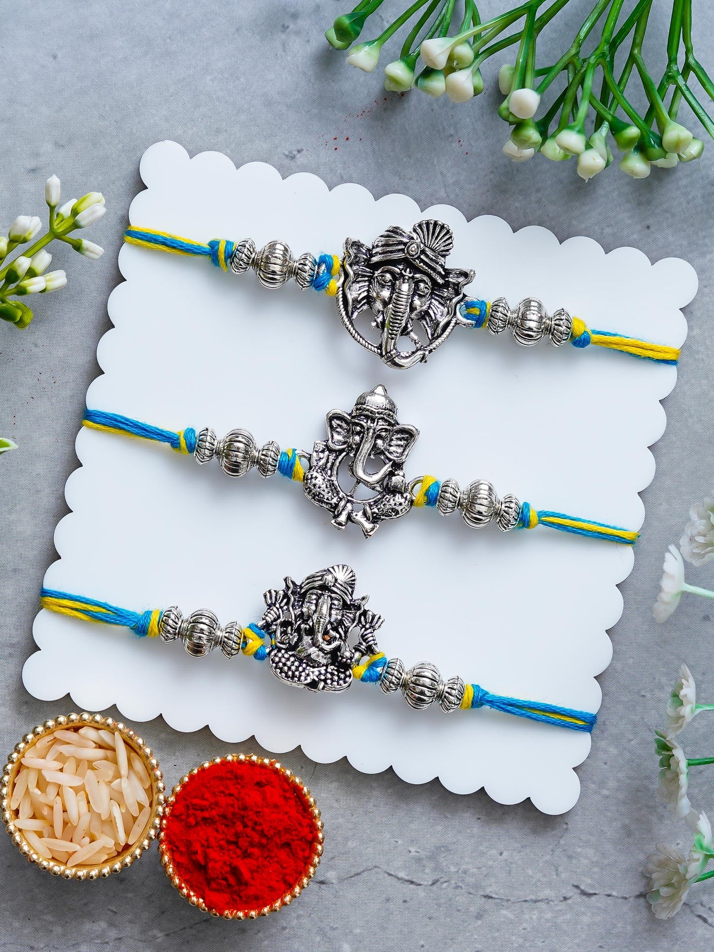 Lord Ganesha Rakhi Set of 3 – Antique Metal Finish – Free Chawal & Kumkum