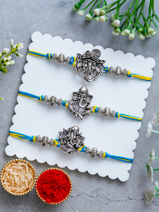 Lord Ganesha Rakhi Set of 3 – Antique Metal Finish – Free Chawal & Kumkum